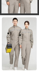 Anti-static flame-resistant welding suit in pure cotton, worn by a man and woman, ideal for work safety.