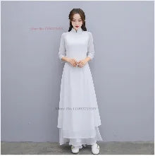 Elegant white Hanbok dress with full sleeves and flowing design, perfect for traditional occasions and celebrations.
