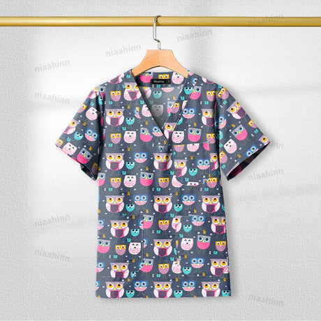Printed nursing scrub top featuring colorful owl design, short sleeve, breathable cotton fabric, ideal for healthcare professionals.