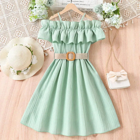 Mint green girls casual dress with one-line shoulder straps and ruffled neckline, styled with a belt and summer accessories.