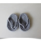 Cozy gray hand-crocheted baby slippers, designed for comfort and style, perfect for infants and toddlers.