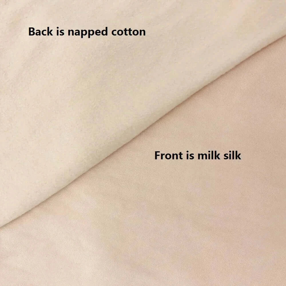 Blanket photo shoot backdrop showing napped cotton on the back and milk silk on the front in neutral colors.