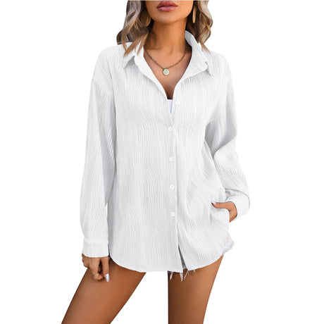 Women's loose fit white blouse with button closure and long sleeves, ideal for streetwear in spring and autumn.