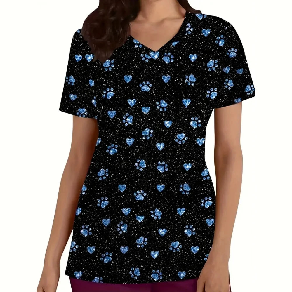 Cartoon cat print vet scrubs featuring blue hearts and paw prints on a black background, short sleeve nurse uniform for women.