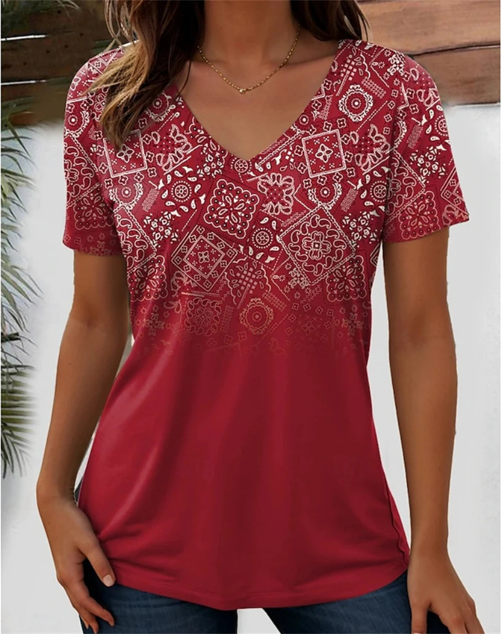 Women’s 3D flower graphic V-neck tee in red, featuring floral patterns and a comfortable fit.