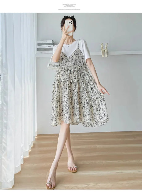 Elegant floral maternity dress showcased in a stylish setting, perfect for summer baby showers.