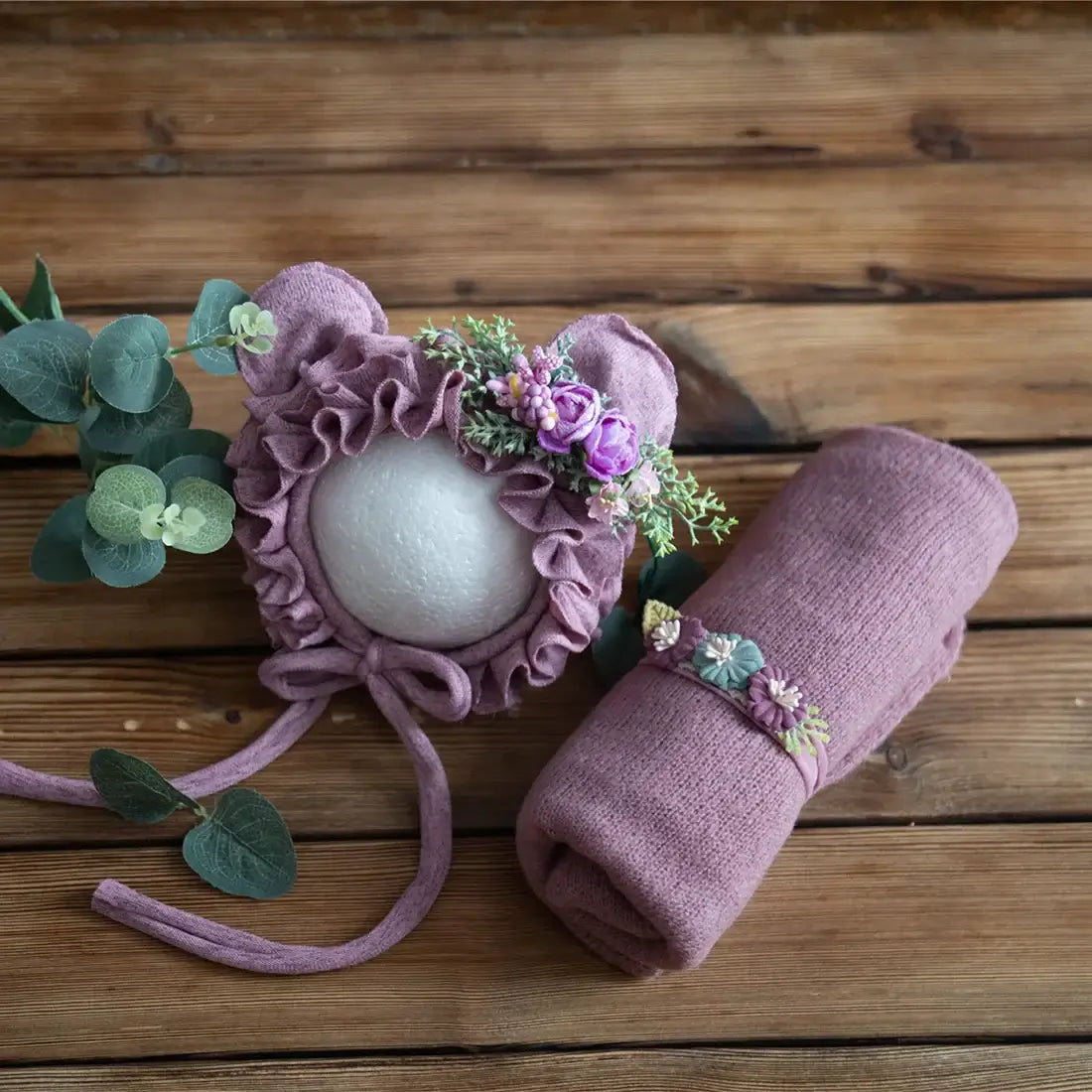 Newborn stretch knit mohair hat and wrap set in purple with floral accents for baby photography and styling.