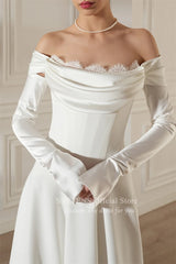 Chic off-shoulder satin wedding dress with detachable sleeves and lace detail from SSYTENS.