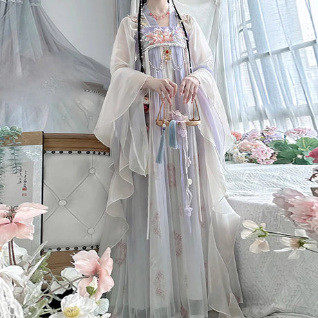 Vintage Chinese style traditional Hanfu dress for women, featuring elegant floral patterns and flowing fabric.