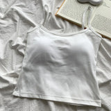 CottoForm™ padded cotton camisole in white, featuring a slim fit and summer sleeveless design on a textured background.