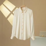 SatinGrace™ long sleeve silk shirt in cream color, featuring a V-neck and single-breasted closure.