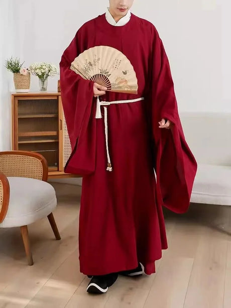Unisex Classic Tang Dynasty Hanfu robe in red, featuring flowing sleeves and a decorative fan, perfect for cultural events.