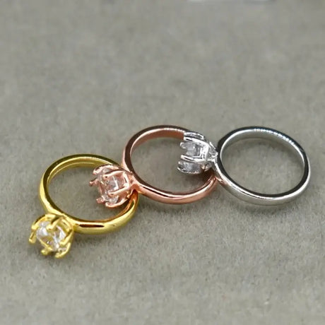 Exquisite newborn baby angel rings set in gold, rose gold, and silver with sparkling gems for ages 0-6 months.