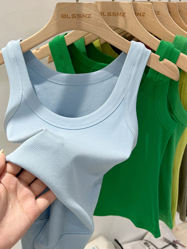 RibFlex™ Basic O-Neck Tank in blue and green hanging on display, showcasing summer ribbed comfort fabric.