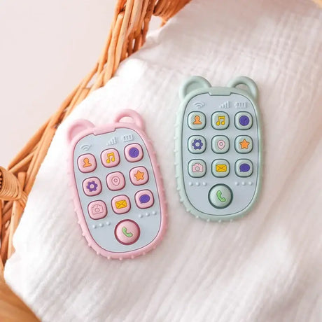 Soft silicone baby toy phones in pink and green, featuring colorful buttons and animal ears, safe for toddlers.