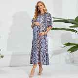 Elegant beach maternity dress in geometric pattern, perfect for summer photoshoots, designed for expectant mothers.