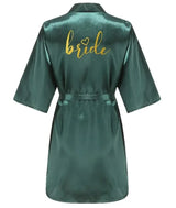 Back view of a green satin kimono robe with gold 'bride' lettering, perfect for bridal parties.