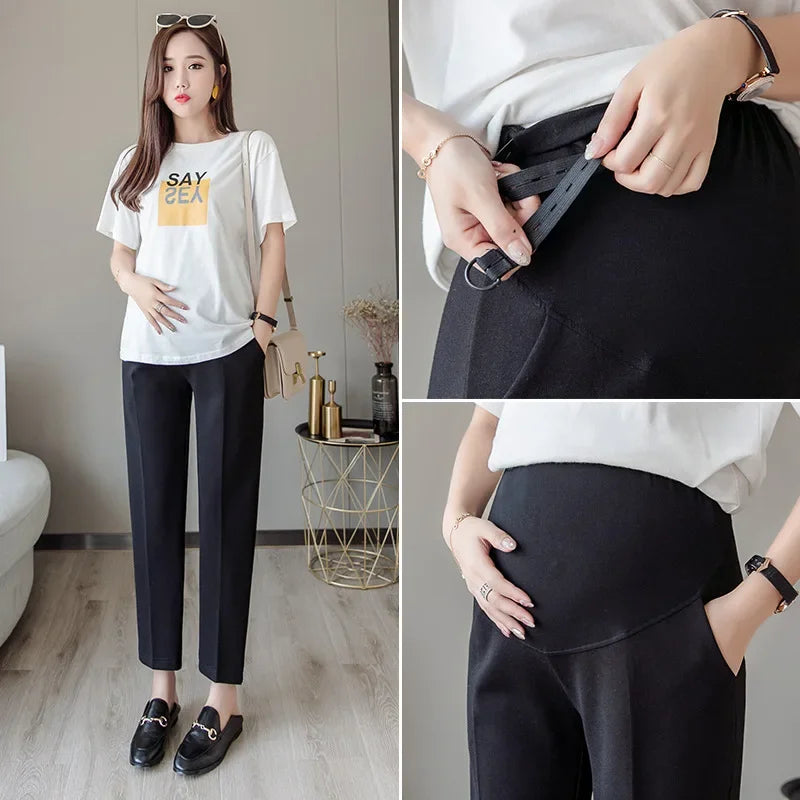 Formal black maternity pants designed for comfort and style, featuring adjustable waistband and pockets, ideal for summer work wear.