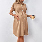 Maternity casual summer dress in solid tan color, featuring a button front and comfortable fit.