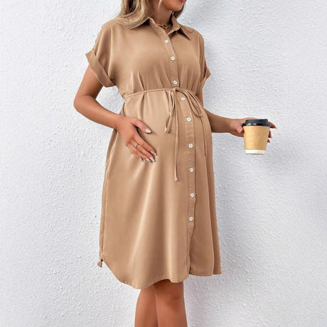 Maternity casual summer dress in solid tan color, featuring a button front and comfortable fit.