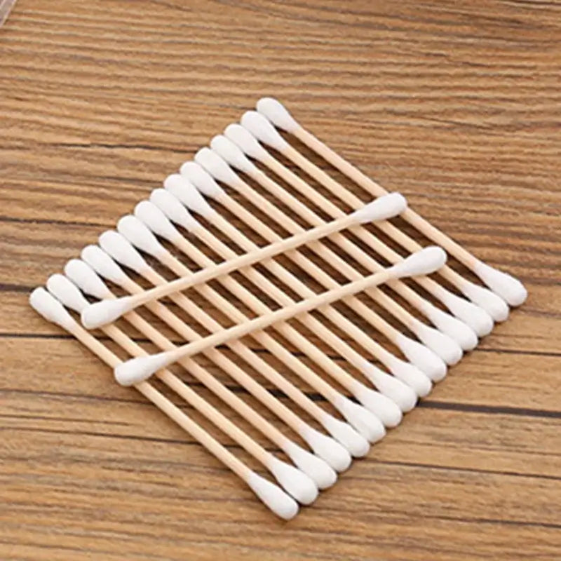 100pcs Baby Cotton Swabs in a bag, wooden sticks and soft cotton tips for babies, perfect for hygiene use.