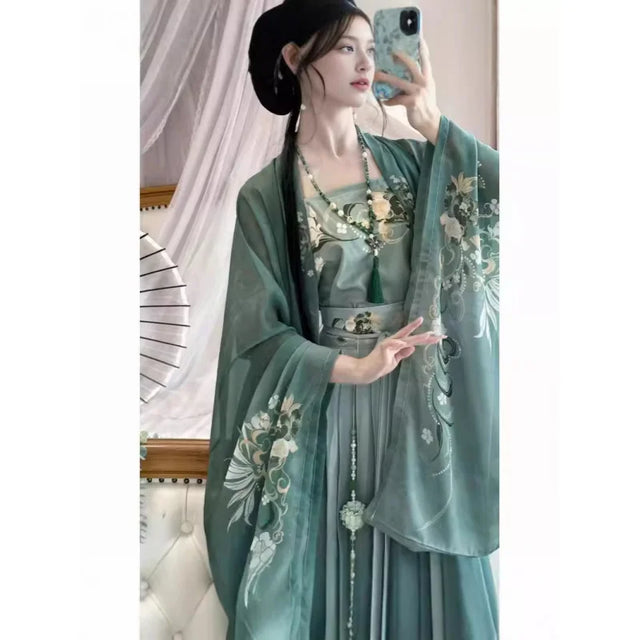 Elegant Song Dynasty Hanfu set featuring chiffon top and skirt with floral prints in soft green color.