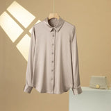 SatinGrace™ Long Sleeve Silk Shirt in a soft beige, featuring a V-neck and button closure, perfect for a chic, loose fit.