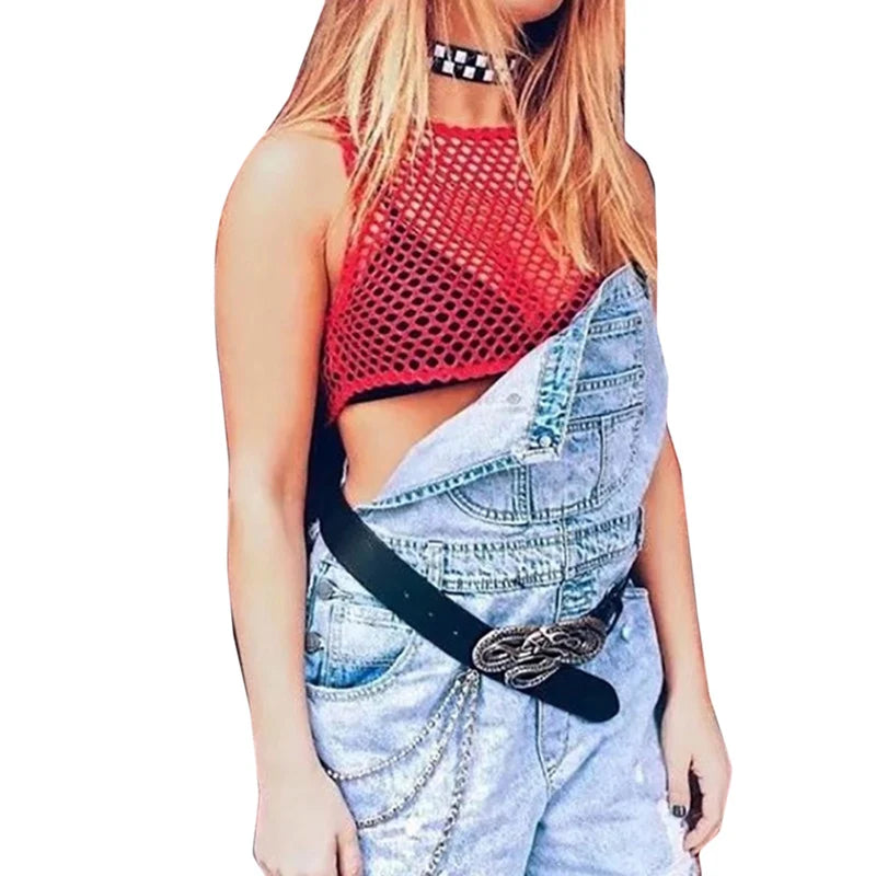 Stylish woman in a red fishnet crop top and denim overalls, perfect for summer casual fashion.