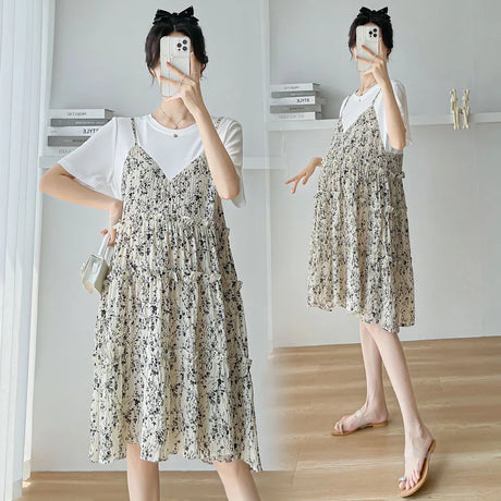 Elegant maternity dress with floral pattern, featuring a knee-length silhouette and casual summer style, perfect for baby showers.