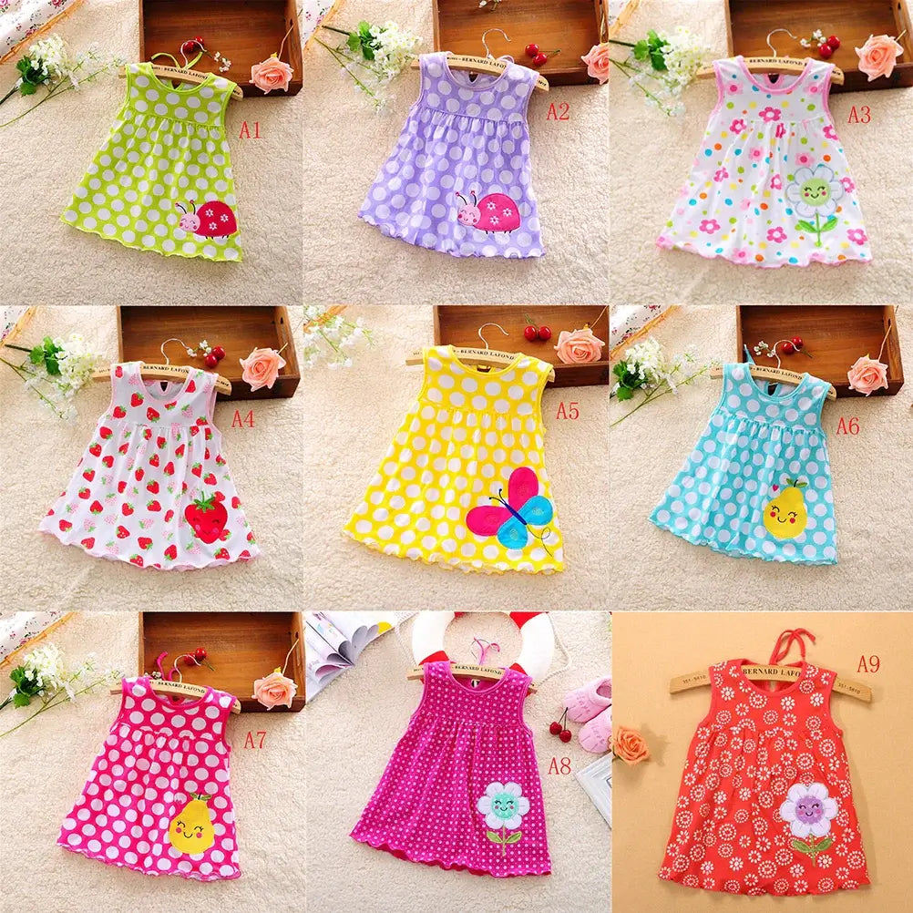 Variety of baby girls' cotton sleeveless dresses featuring floral and polka dot patterns, ideal for summer wear.
