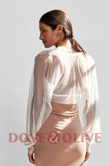 Elegant black tulle bridal cape by Dove&Olive, featuring long sleeves and a stylish design for weddings.