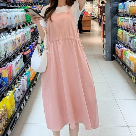 Korean loose fit maternity dress in pink, ideal for casual outings and holiday photography.