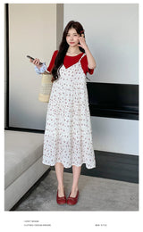 Model wearing a floral two-piece maternity skirt in contrast colors, perfect for summer and designed for comfort.