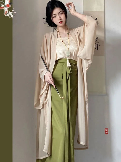 Woman wearing a beige Princess Song Dynasty Hanfu robe with green pants, showcasing a blend of traditional and modern styles.