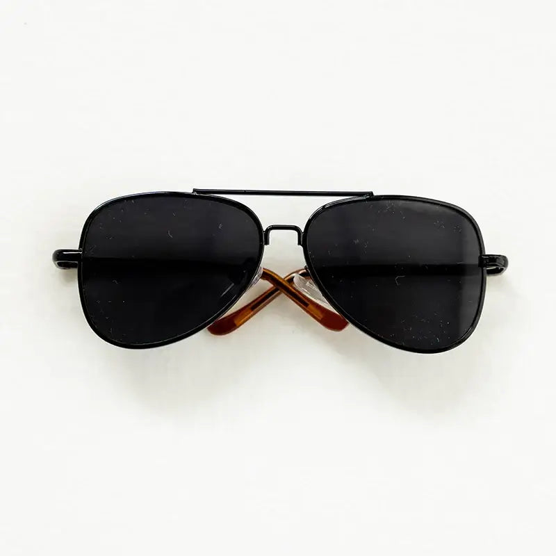 Black round sunglasses with brown arms, perfect for newborn photography accessories and playful baby photo shoots.