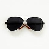 Black round sunglasses with brown arms, perfect for newborn photography accessories and playful baby photo shoots.