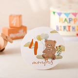 Baby milestone card featuring a teddy bear and the number 4 months, ideal for capturing precious memories.