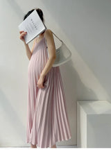Pleated chiffon maternity dress in soft pink, mid-calf length, perfect for summer wear.