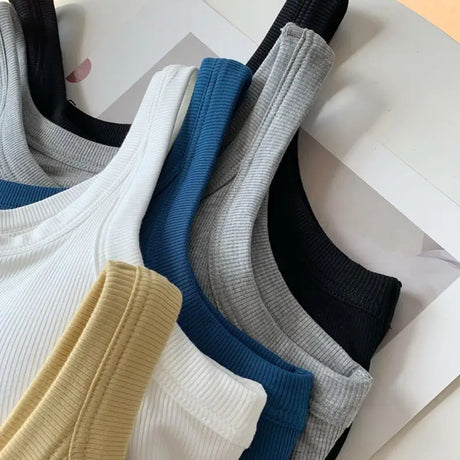 SlimCotz™ padded cotton spaghetti camis in various colors, perfect for summer and breathable wear.