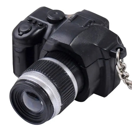 Mini camera for dollhouse, black plastic design, ideal for baby photography props and kids' creative play.