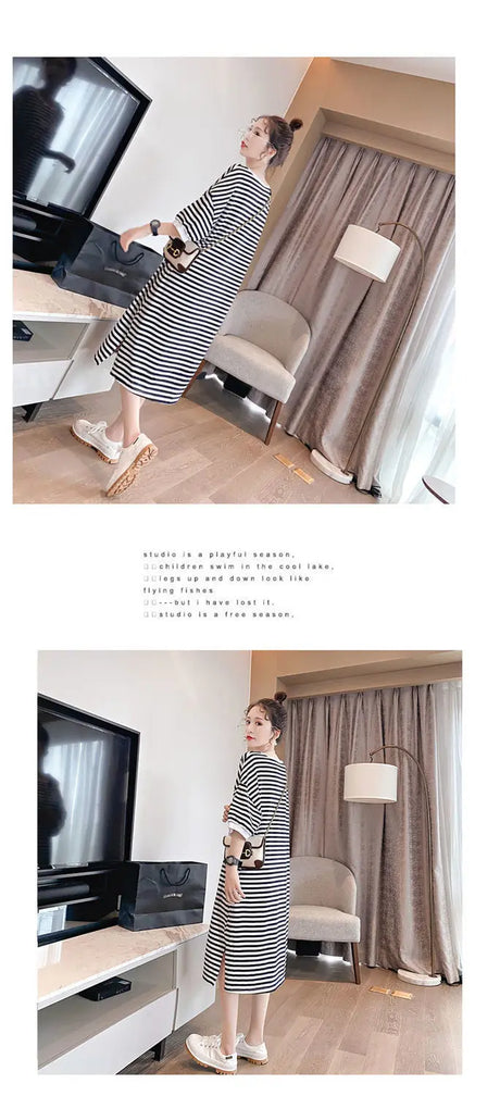 Model wearing a striped t-shirt maternity dress in a modern living room setting, showcasing a loose fit and boat neck design.