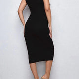 Rear view of a woman wearing a knee-length solid color high stretch maternity dress in black.