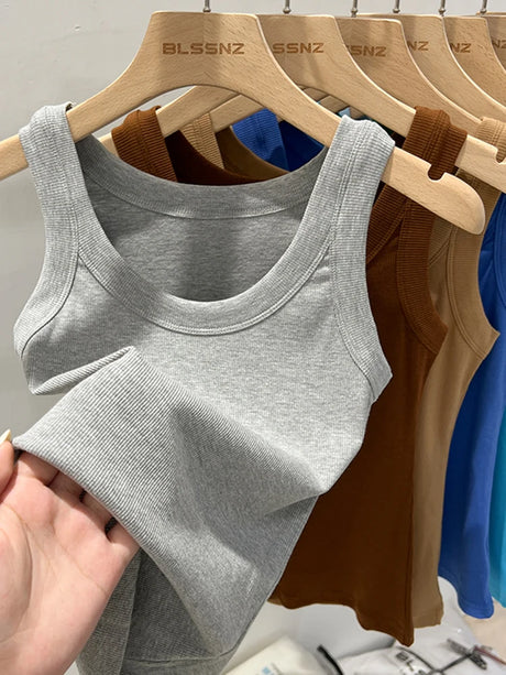 RibFlex™ Basic O-Neck Tank in gray displayed on hangers with assorted colors, featuring high elasticity and comfortable ribbed fabric.