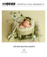 Newborn girl in adjustable faux flower headband, showcasing sweet moments in baby photography.