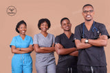 Group of four healthcare professionals wearing scrubs, showcasing breathable medical uniforms in diverse styles and colors.