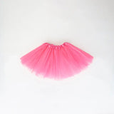 Baby pink tulle tutu skirt on a white background, perfect for toddler dress-up and special occasions.