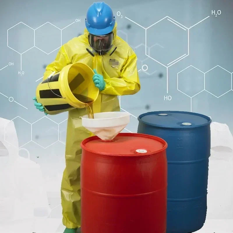 Person in a chemical resistant work coverall pouring liquid into a red barrel, showcasing safety and protection.