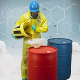 Person in a chemical resistant work coverall pouring liquid into a red barrel, showcasing safety and protection.