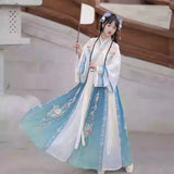 Woman wearing a beautiful Hanfu traditional dress, ideal for parties and cultural events, featuring floral designs and flowing fabric.