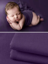 Newborn soft wrap blanket in purple, ideal for photography; soft fabric, unisex design for infants.